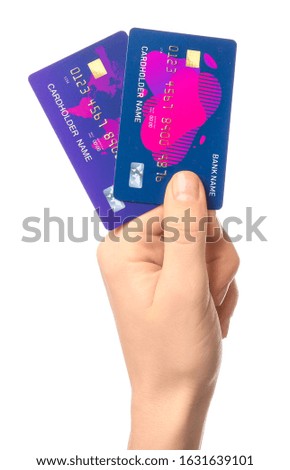 Female hand with credit cards on white background