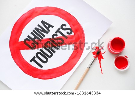 Coronavirus and tourism. Sign of the ban on tourists from China. Text China Tourists in red International NO symbol. Danger of virus infection