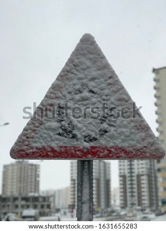 Image of road and traffic sign under snow