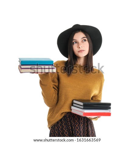 Beautiful young woman with books on white background