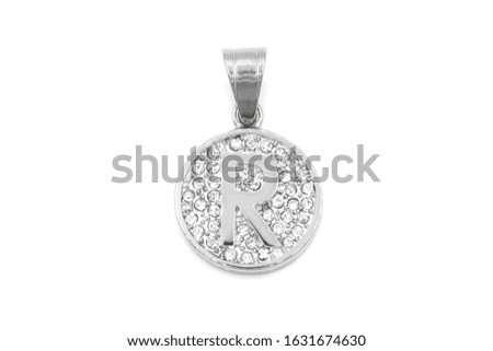 Jewelry pendant. Letter of the alphabet. Stainless steel with cubic zircons. White color background