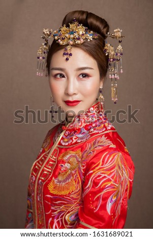 Good looking traditional Asian matchmaker dress up