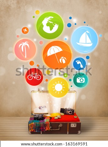 Suitcase with colorful summer icons and symbols on grungy background