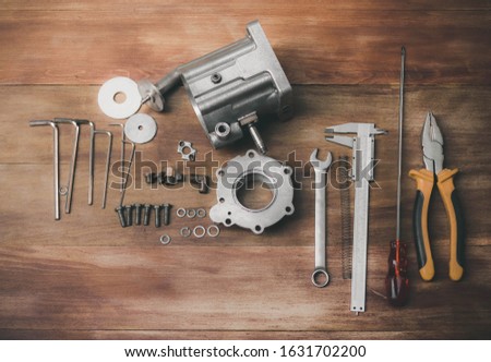 Pictures of tools and machine part in factories waiting to be repaired That is caused by continuous work damage Photos from the top view