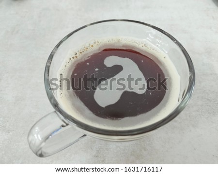 A picture of coffee in glass.