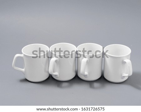 white cups for sublimation in composition on a gray background