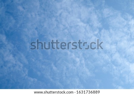 Blurry white clouds and blue sky for background