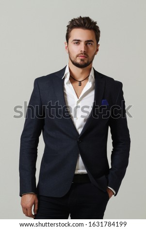
Businessman in studio on gray background. Successful businessman Royalty-Free Stock Photo #1631784199