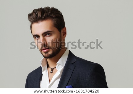 
Businessman in studio on gray background. Successful businessman Royalty-Free Stock Photo #1631784220