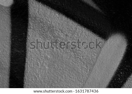  Beautiful black and white street art graffiti background. The wall is decorated with abstract drawings house paint. Modern style urban culture of street youth. Abstract picture on wall
