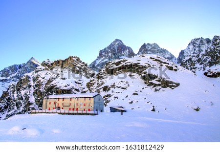 Winter view on Monviso and Pian del Re shelter inn, Cuneo, Piedmont, Italy, in a sunny clear morning
