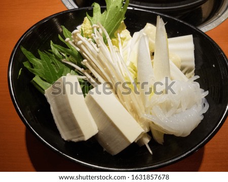 Ingredients in bowl for Sukiyaki at Japanese restaurant.