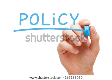 Hand writing Policy with blue marker on transparent wipe board.