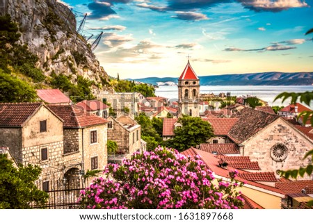 Cityscape of old croatian resort - Omis town. Adriatic sea, Dalmatia coast, Croatia, Europe. Summer sunset. Travel Croatia Royalty-Free Stock Photo #1631897668