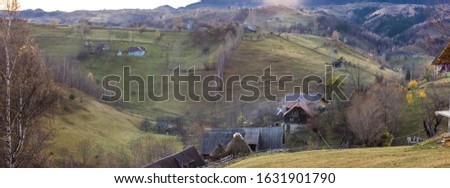 Autumn colours , Romanian rural panorama landscape. Nature landscape with Carpathian mountain in the background. Magura
