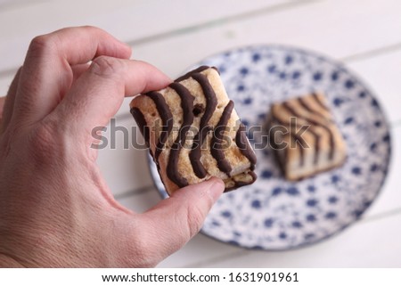 small chocolate cakes in color background