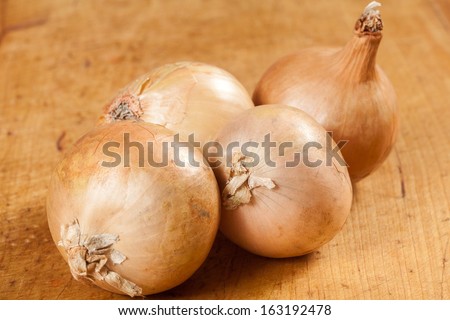 Onions on a wooden board 