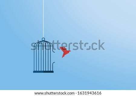Flying bird and cage. Freedom concept. Emotion of freedom and happiness. Minimalist style. Royalty-Free Stock Photo #1631943616