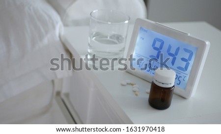 Medical Drugs and Pills near a Clock on the Table in a Hospital Room, Medicament Vitamins and Antibiotics