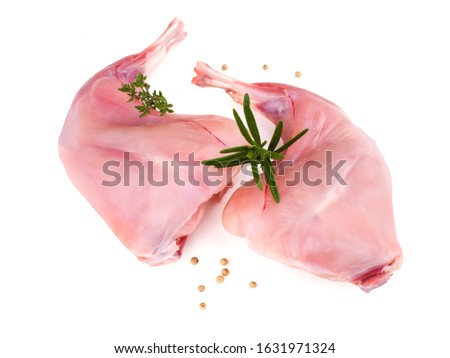 two raw rabbit legs isolated on white background