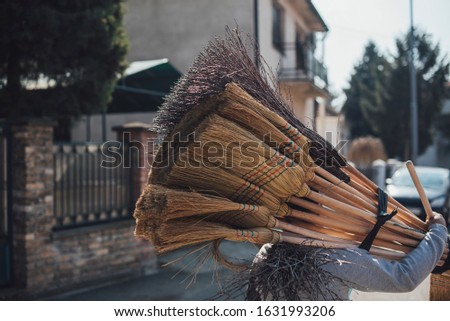 Broom Seller Walking The Streets