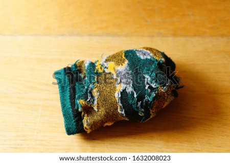 A closeup shot of a sock on a wooden surface