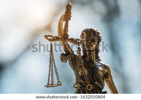 The Statue of Justice - lady justice or Iustitia / Justitia the Roman goddess of Justice in lawyer office Royalty-Free Stock Photo #1632010804