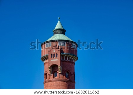 Historic red brick water tower built around 1900 in Berlin, Germany.