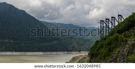 The Enguri (or Inguri) Dam in Georgia is a concrete arch dam built during the Soviet period. A picture of abandonment and desolation. The dam functions and is shared with Abkhazia. Mountainous region