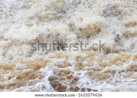 Soft beautiful ocean wave on a sandy beach. Background, summer sand beach background.