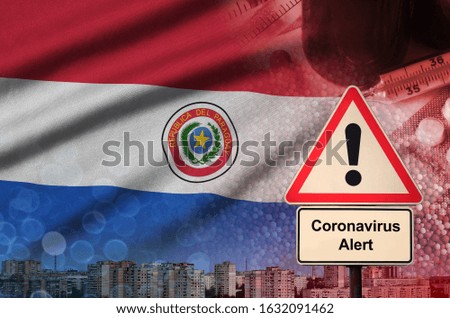 Paraguay flag and Coronavirus 2019-nCoV alert sign. Concept of high probability of novel coronavirus outbreak through traveling tourists