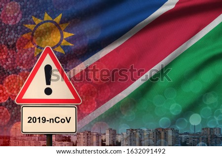 Namibia flag and Coronavirus 2019-nCoV alert sign. Concept of high probability of novel coronavirus outbreak through traveling tourists