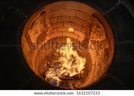 Traditional turkish wood fired stone brick oven. This stone oven for Turkish pide or pita bread. Also known as Tandır or Tandir. Royalty-Free Stock Photo #1632107233