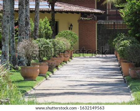 Entrance to luxury homes. Path surrounded by grasses