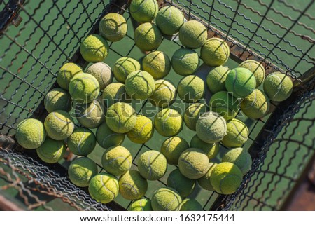 Tennis balls in iron basket