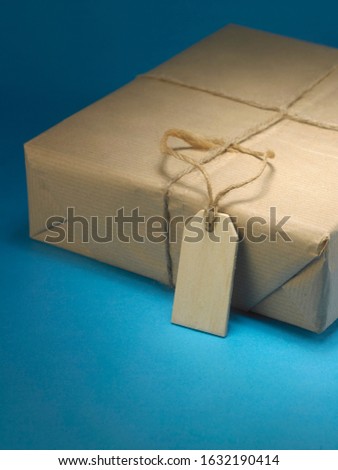 parcel wrapped with the brown paper  string with blank tag