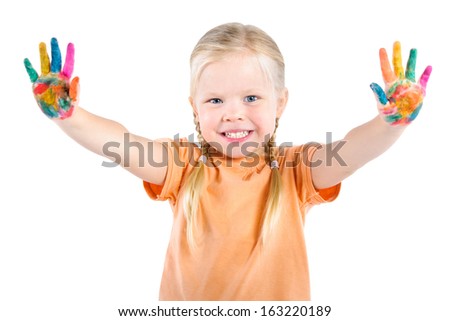 happy little girl showing up  her hands in the paint, isolated on white background