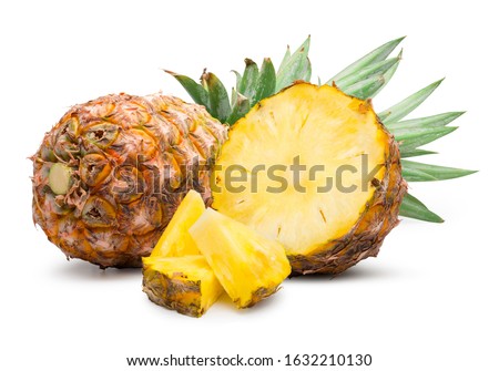 Ripe pineapple cut in half and pineapple slice isolated on white with clipping path.