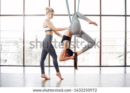 Beautiful girls in the gym. A women doing a yoga