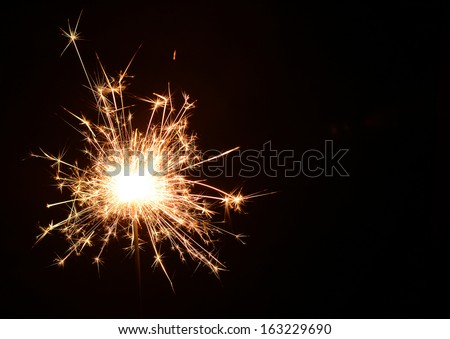 Christmas and newyear party sparkler on black Royalty-Free Stock Photo #163229690