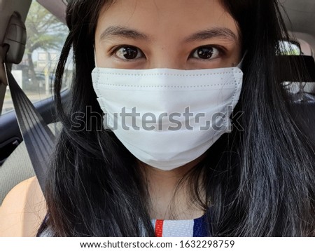 People is wearing faced mask every time when going outside even driving time to protect and prevent Corona Virus or Wuhan Virus in Asia. Royalty-Free Stock Photo #1632298759