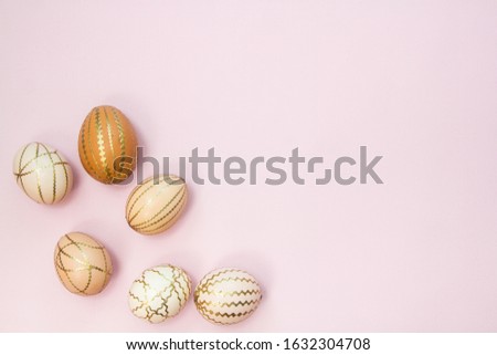 Easter eggs  on a pink pastel background. Beautiful festive background, religious concept.
