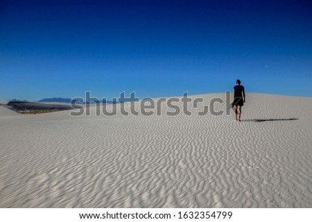 Person walking on white sand dunes, White Sands National Monument, New Mexico