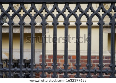 Image of a Beautiful decorative cast iron wrought fence with artistic forging. Metal guardrail close up. beautiful abstract background. Texture as background. 