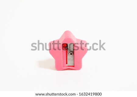 close-up pink sharpener a pencil isolated on white background