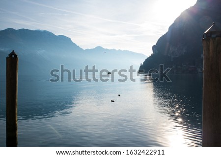 Riva del Garda.Lake Garda in northern Italy. Melancholic and romantic view of the lake at sunset