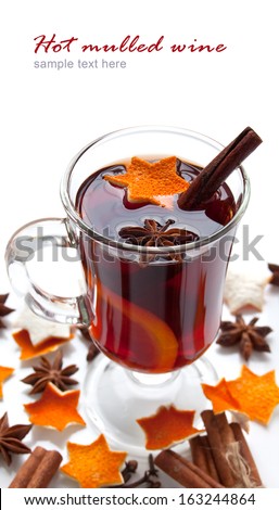 Mulled wine with slice of orange and spice. Christmas background