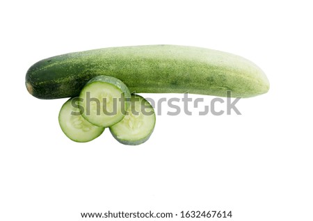 Cucumber sliced into pieces isolated on white background