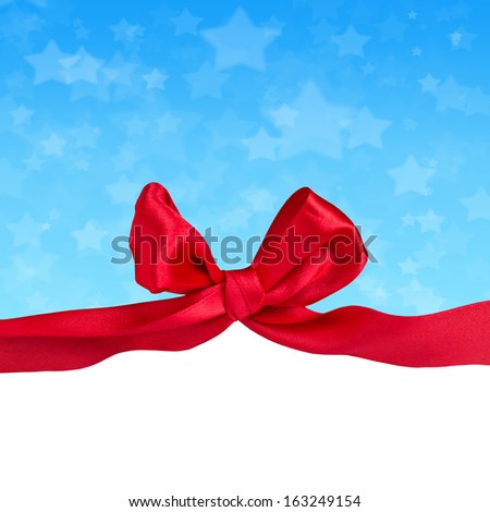 Greeting card with  red satin ribbon and bow.