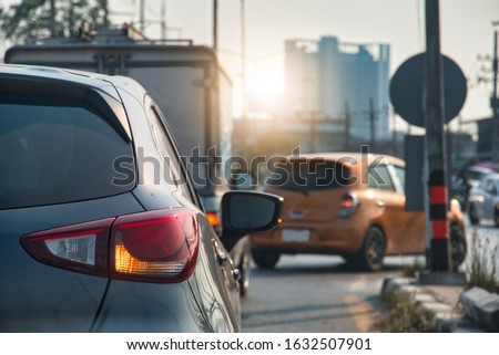 Transportation of luxury car open turn right signal prepare for U-Turn in the city. Royalty-Free Stock Photo #1632507901